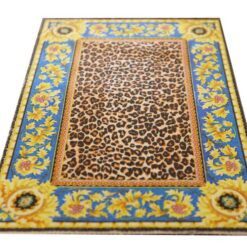 Miniature dollhouse rug with leopard print center and golden sunflower border