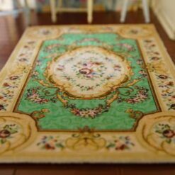 Miniature dollhouse rug in French Aubusson style with mint green background