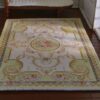 Miniature Victorian rug in green with floral medallion