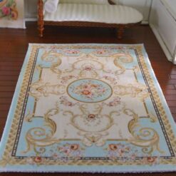 Victorian miniature rug in blue with floral medallion
