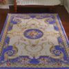Miniature Victorian rug in dark blue with floral accentsMiniature Victorian rug in dark blue with floral accents