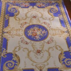 Miniature Victorian rug in dark blue with floral accents