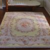 Aubusson style miniature rug with yellow floral border
