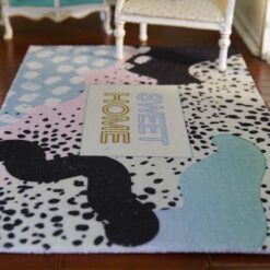 Modern abstract rug with pastel colors and "SWEET HOME" text