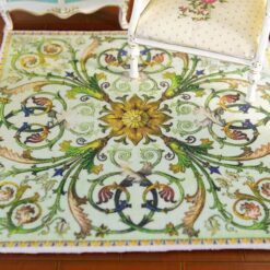Green miniature rug with sunflower medallion, birds, and swirling floral vines, perfect for nature-inspired dollhouses.