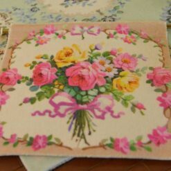 Bouquet of pink and yellow roses tied with a ribbon, a vibrant miniature Aubusson tapestry.