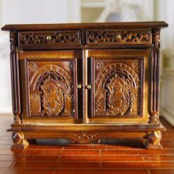 Victorian miniature cabinet with ornate carvings and walnut finish