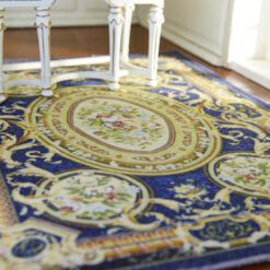 Royal Aubusson miniature rug featuring floral medallions and intricate scrolls in blue and cream