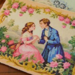 Romantic couple in a rose-filled garden with intricate golden borders, a miniature Aubusson tapestry.