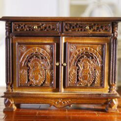 Victorian miniature cabinet with ornate carvings and walnut finish