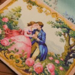 Romantic couple in a floral garden with golden accents, a miniature Aubusson tapestry.