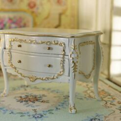 Rococo-style white miniature dresser with golden accents for dollhouses