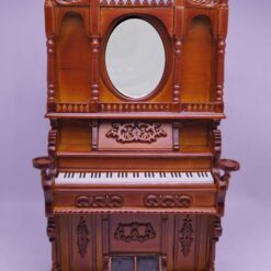Victorian-style miniature wooden organ with mirror and carvings