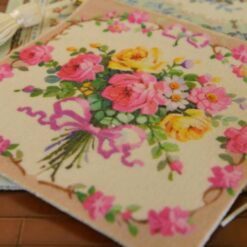 Bouquet of pink and yellow roses tied with a ribbon, a vibrant miniature Aubusson tapestry.