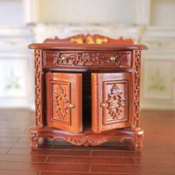 Baroque-style miniature vanity sink with gold faucet