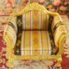 Golden Rococo-style miniature armchair with striped upholstery