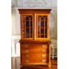 Miniature hutch with glass doors and a polished wood finish.