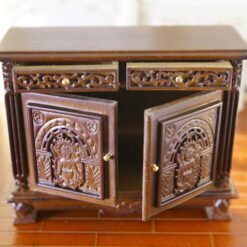 Victorian miniature cabinet with ornate carvings and walnut finish