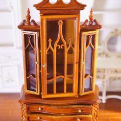 Miniature Gothic-style display cabinet with glass doors and mahogany finish.
