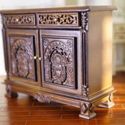 Victorian miniature cabinet with ornate carvings and walnut finish