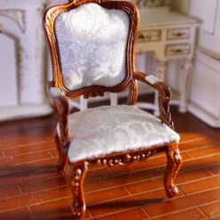 Rococo-style dollhouse miniature armchair with white upholstery and mahogany wood frame