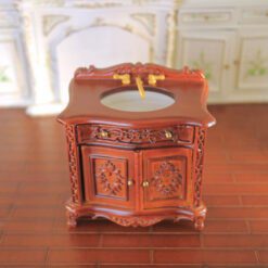 Baroque-style miniature vanity sink with gold faucet