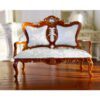 Victorian-Style Miniature Loveseat 1 Victorian-style miniature loveseat with carved details and luxurious cushion