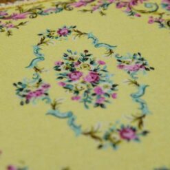 Elegant square Victorian miniature rug with floral details in soft pastel colors, perfect for your dollhouse.