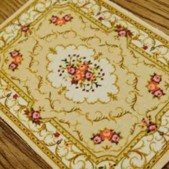 Miniature Aubusson floral rug in soft pastel colors with vintage design.