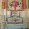 Golden urn filled with roses and flowers framed by an intricate floral border, a miniature Aubusson tapestry