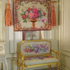 Golden urn filled with roses and flowers framed by an intricate floral border, a miniature Aubusson tapestry