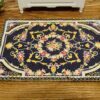 Miniature Louis XIV royal Aubusson rug in black with floral motif.