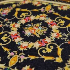 Miniature Louis XIV royal Aubusson rug in black with floral motif.