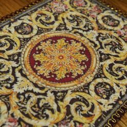 Miniature Aubusson rug with acanthus scroll design and ornate pattern.