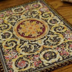 Miniature Aubusson rug with acanthus scroll design and ornate pattern.