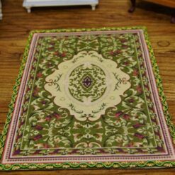Miniature modern Persian rug in olive green with geometric and floral pattern.