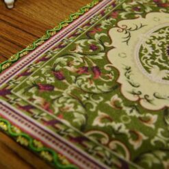 Miniature modern Persian rug in olive green with geometric and floral pattern.