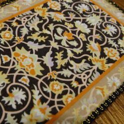 Miniature modern Persian rug with floral design and elegant colors.