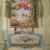 Blooming floral arch with vivid roses and a countryside backdrop in a miniature Aubusson tapestry.
