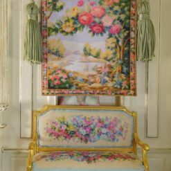 Blooming floral arch with vivid roses and a countryside backdrop in a miniature Aubusson tapestry.