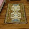 Miniature Aubusson rug with beige, brown, and blue tones and intricate design