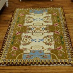 Miniature Aubusson rug with beige, brown, and blue tones and intricate design