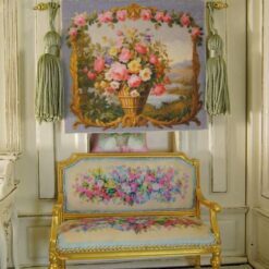A charming small Aubusson Tapestry of a basket full of roses and daisies The golden border makes it look archaic and the scenery does that rustic charm to this picture worn by them.