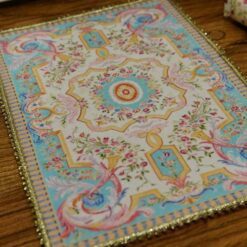 Miniature Louis XV French Aubusson rug in sky blue and cream with floral motifs.