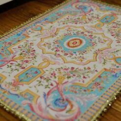 Miniature Louis XV French Aubusson rug in sky blue and cream with floral motifs.
