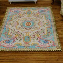 Miniature Louis XV French Aubusson rug in sky blue and cream with floral motifs.