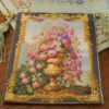 Golden vase overflowing with roses and wildflowers framed by intricate gold, a miniature Aubusson tapestry.