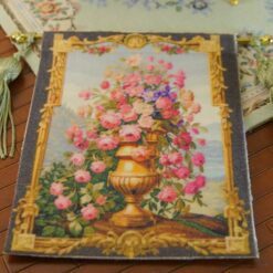 Golden vase overflowing with roses and wildflowers framed by intricate gold, a miniature Aubusson tapestry.