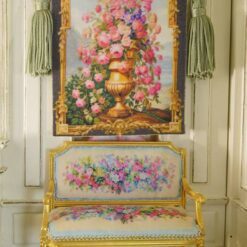 Golden vase overflowing with roses and wildflowers framed by intricate gold, a miniature Aubusson tapestry.