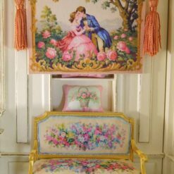 Romantic couple in a floral garden with golden accents, a miniature Aubusson tapestry.
